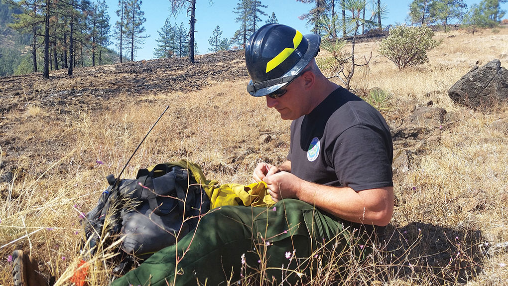 The Fire Man sewing